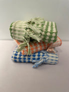 towel checkered with tied fringe blue green and orange with cream