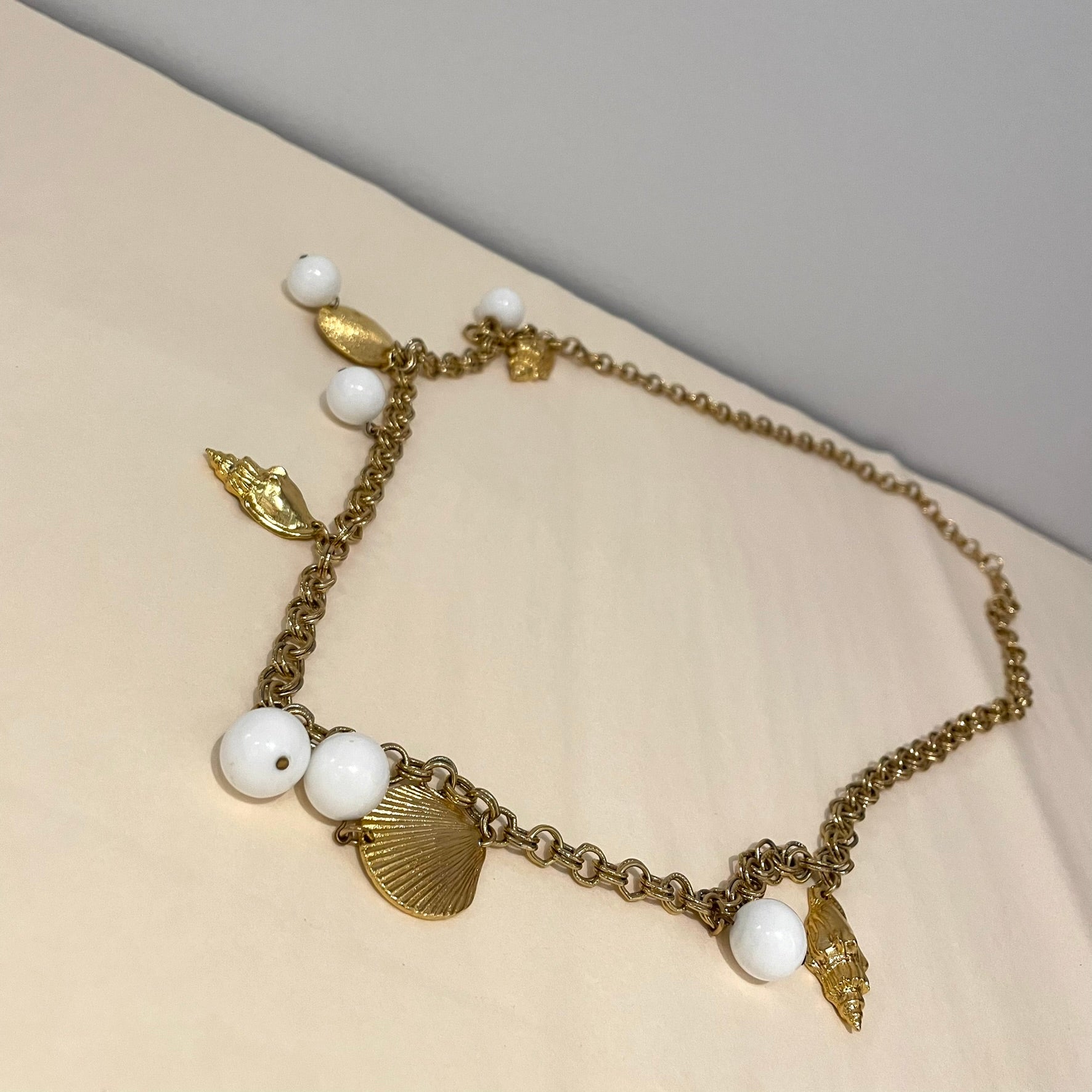Vintage gold plated necklace with white acrylic beads gold chain shell charms 15 inch length