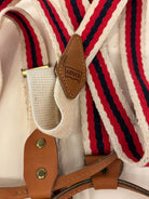 Close-up of suspenders with a Levi's logo on a white background